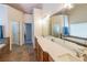 Bright bathroom featuring double sinks, a soaking tub, tile floors and a separate shower at 103 Gold Springs Ct, Canton, GA 30114