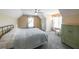 Bright bedroom with neutral carpet, a ceiling fan, and ample natural light from two windows at 103 Gold Springs Ct, Canton, GA 30114