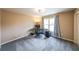 Cozy bedroom with carpeting, a window, and a dedicated workspace with a desk at 103 Gold Springs Ct, Canton, GA 30114