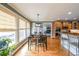 Bright dining area with natural light, open to the kitchen with hardwood flooring at 103 Gold Springs Ct, Canton, GA 30114
