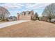 Beautiful two-story home with a well-manicured front lawn, multiple garage doors and driveway at 103 Gold Springs Ct, Canton, GA 30114