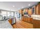 Spacious kitchen with granite countertops, wooden cabinets, and stainless steel appliances at 103 Gold Springs Ct, Canton, GA 30114