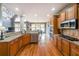 Gourmet kitchen with granite countertops, stainless steel appliances, and custom cabinetry at 103 Gold Springs Ct, Canton, GA 30114