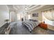 Large primary bedroom with a tray ceiling, sitting area, and neutral carpeting at 103 Gold Springs Ct, Canton, GA 30114