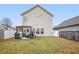 Well-maintained backyard featuring a pergola, patio set, grill, and a spacious green lawn at 21 Samuel Nw Way, Cartersville, GA 30121