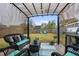 Relaxing backyard patio featuring an outdoor kitchen, comfortable seating, and a shaded pergola with stylish lighting at 21 Samuel Nw Way, Cartersville, GA 30121