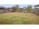 Large backyard with mature lawn, wood fence, and outdoor seating with Adirondack chairs around a fire pit at 21 Samuel Nw Way, Cartersville, GA 30121