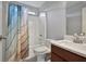 This bathroom has a shower/tub combo, a cherry vanity, and a large vanity mirror at 21 Samuel Nw Way, Cartersville, GA 30121