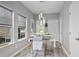 Dining room features modern decor, a stylish light fixture, and large windows for natural light at 21 Samuel Nw Way, Cartersville, GA 30121