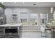 This kitchen features a stainless microwave in the island and three windows to the backyard for lots of natural light at 21 Samuel Nw Way, Cartersville, GA 30121