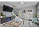 Comfortable living room with stairs, modern decor, fireplace and large television at 21 Samuel Nw Way, Cartersville, GA 30121