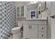 Bathroom featuring a white vanity with a spacious countertop and a blue patterned shower curtain at 5159 Roswell Rd # 7, Sandy Springs, GA 30342