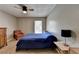 Bedroom with blue comforter, neutral walls, dresser, and window creating a cozy, inviting atmosphere at 5159 Roswell Rd # 7, Sandy Springs, GA 30342