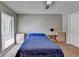 Cozy bedroom with neutral walls, a large window, and a ceiling fan at 5159 Roswell Rd # 7, Sandy Springs, GA 30342