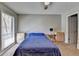 Bedroom featuring neutral walls, blue bedding, and a window providing lots of natural light at 5159 Roswell Rd # 7, Sandy Springs, GA 30342