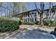 Traditional condo building showcasing lush landscaping and ample parking at 5159 Roswell Rd # 7, Sandy Springs, GA 30342