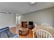 Open living room featuring hardwood floors, a dining table, media center, and a view of the entryway at 5159 Roswell Rd # 7, Sandy Springs, GA 30342