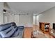 Living room with hardwood floors, a barn door, and access to other living spaces at 5159 Roswell Rd # 7, Sandy Springs, GA 30342