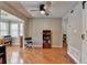 Open living room area with hardwood floors, a bookshelf, and a comfortable seating arrangement at 5159 Roswell Rd # 7, Sandy Springs, GA 30342