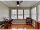 Bright office with hardwood floors, ceiling fan, desk, and large windows providing ample natural light at 5159 Roswell Rd # 7, Sandy Springs, GA 30342
