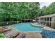 Community pool with lounge chairs, a gazebo, and mature shade trees at 5159 Roswell Rd # 7, Sandy Springs, GA 30342