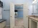 View from bathroom shows bedroom featuring a tray ceiling and an abundance of natural light at 2158 Berryhill Se Cir, Smyrna, GA 30082