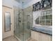 A tiled walk-in shower with a glass enclosure and convenient built-in shelving enhances this bathroom at 2158 Berryhill Se Cir, Smyrna, GA 30082