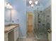 This elegant bathroom features a granite countertop, dual vanity, and a luxurious glass-enclosed shower at 2158 Berryhill Se Cir, Smyrna, GA 30082