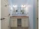 This bathroom offers a double vanity with stone countertops and a large framed mirror at 2158 Berryhill Se Cir, Smyrna, GA 30082