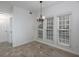Bright dining area with three windows and a chandelier, perfect for enjoying meals at 2158 Berryhill Se Cir, Smyrna, GA 30082