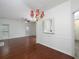 Dining room with hardwood floors, chandelier, and pass-through to the kitchen at 2158 Berryhill Se Cir, Smyrna, GA 30082