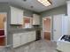 Modern kitchen featuring tile flooring, stainless steel dishwasher, and ample cabinet space at 2158 Berryhill Se Cir, Smyrna, GA 30082