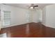 Living room showcasing hardwood floors, windows with blinds, and an open floor plan at 2158 Berryhill Se Cir, Smyrna, GA 30082