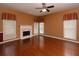 Bright living room featuring a fireplace, hardwood floors, and large windows at 2158 Berryhill Se Cir, Smyrna, GA 30082