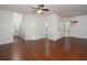 Open-concept layout with hardwood floors that connect the living room, kitchen and dining area at 2158 Berryhill Se Cir, Smyrna, GA 30082