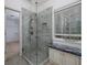 Modern glass enclosed shower boasts tile surround, built-in niche and adjacent granite countertop at 2158 Berryhill Se Cir, Smyrna, GA 30082