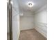 A walk-in closet provides generous storage space with wire shelving and carpet flooring at 2158 Berryhill Se Cir, Smyrna, GA 30082