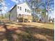 Exterior view of home with wooden deck and large backyard at 3170 Old Hwy 92 Dr, Acworth, GA 30102