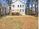 Rear exterior featuring a spacious wooden deck with stairs leading to backyard at 3170 Old Hwy 92 Dr, Acworth, GA 30102