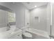 Modern bathroom design with a tub, shower, and window at 3170 Old Hwy 92 Dr, Acworth, GA 30102