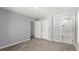 Open bedroom with carpet flooring and double door access to bathroom at 3170 Old Hwy 92 Dr, Acworth, GA 30102