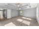 Bright bedroom with a tray ceiling, ceiling fan, and natural light from the window at 3170 Old Hwy 92 Dr, Acworth, GA 30102