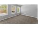 Sunlit bedroom featuring plush carpeting and nature views from the new windows at 3170 Old Hwy 92 Dr, Acworth, GA 30102