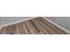 Close up of wood-look flooring, neutral gray walls, and bright white trim at 3170 Old Hwy 92 Dr, Acworth, GA 30102