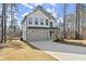 Charming two-story home featuring stone accents and a gray two-car garage at 3170 Old Hwy 92 Dr, Acworth, GA 30102