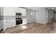 Modern kitchen with white cabinets, stainless steel appliances, and gray walls at 3170 Old Hwy 92 Dr, Acworth, GA 30102
