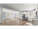 Open-concept living room featuring modern fixtures, natural light and hardwood flooring at 3170 Old Hwy 92 Dr, Acworth, GA 30102