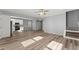 Open floor plan showcasing hardwood floors and a combined living room, kitchen, and dining area at 3170 Old Hwy 92 Dr, Acworth, GA 30102