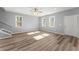Bright living room with beautiful wood floors, a ceiling fan, and plenty of natural light at 3170 Old Hwy 92 Dr, Acworth, GA 30102