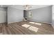 Spacious living room featuring hardwood floors, natural lighting, and a ceiling fan at 3170 Old Hwy 92 Dr, Acworth, GA 30102
